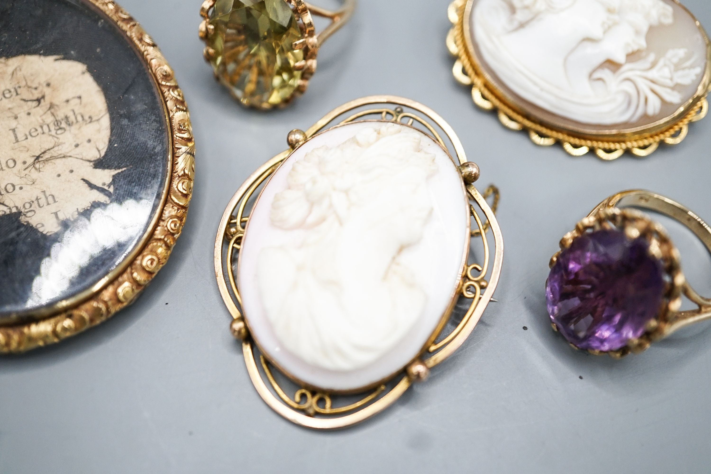 Two modern 9ct gold and gem set rings, a 9ct and gem set pendant, two 9ct mounted cameo shell brooches, gross weight 36.5 grams and a Victorian oval pendant frame, 55mm.